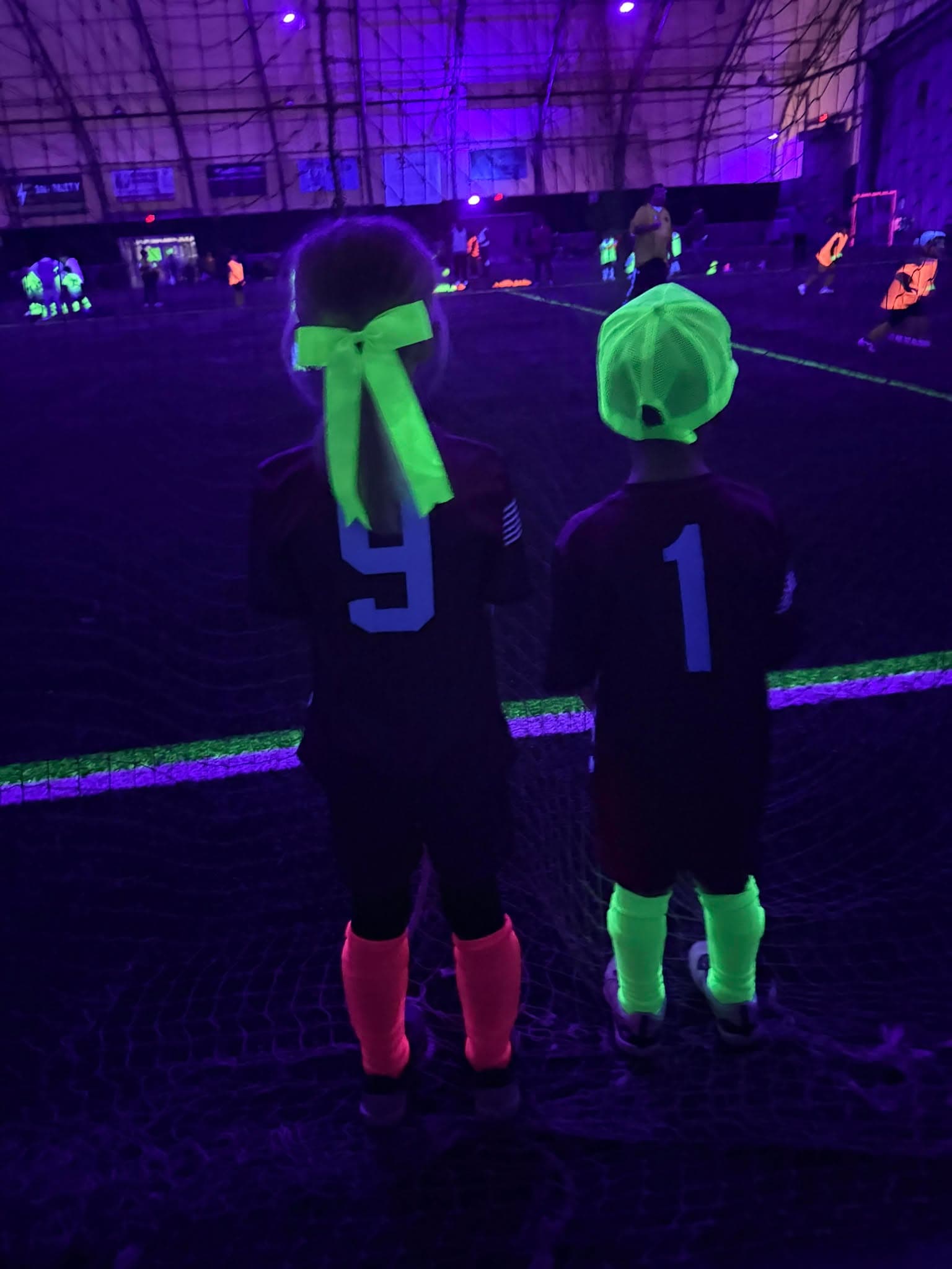 Young Raptors players enjoying soccer together.